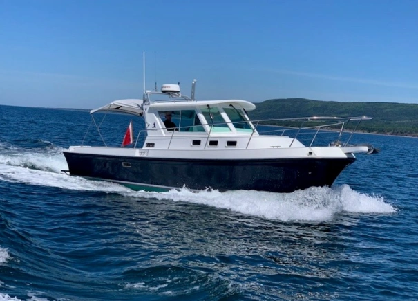 Private boat arriving at island